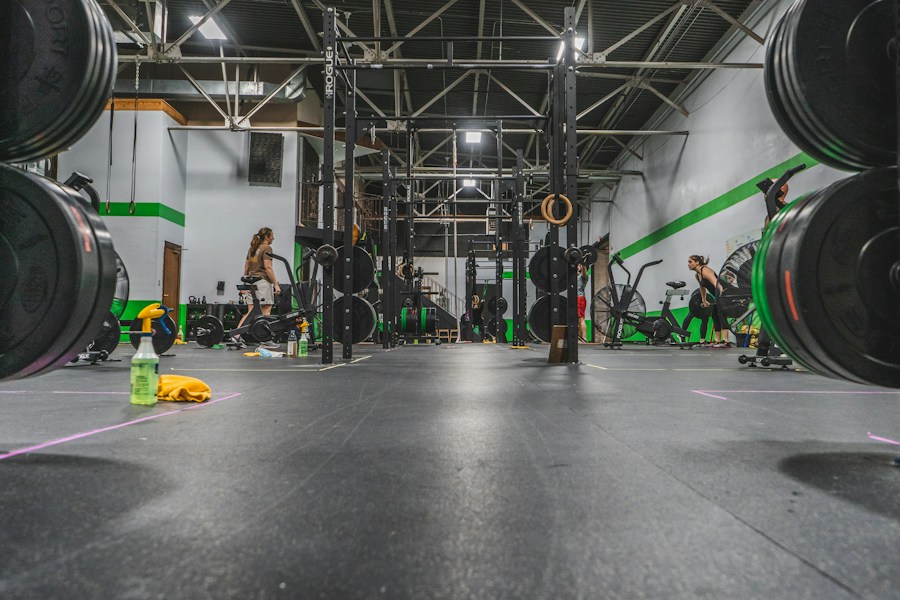 People training together in an open warehouse gym